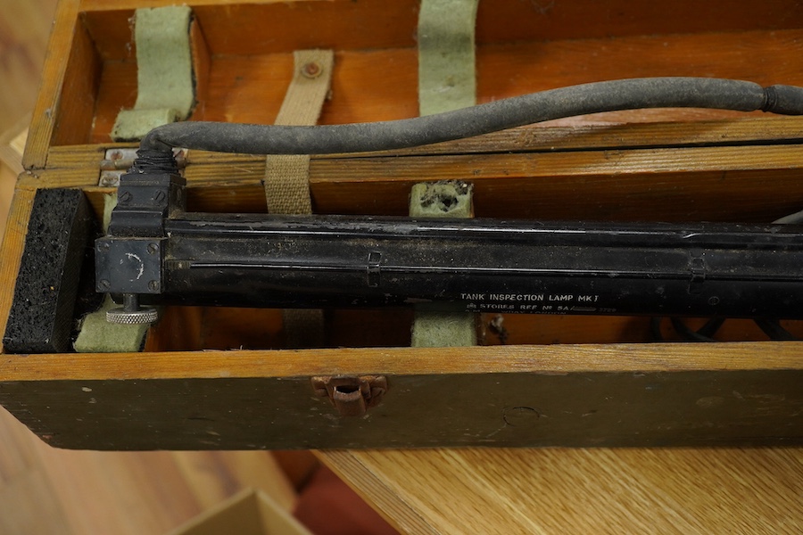 An Air Ministry First World War cased tank inspection lamp, 78cm long, together with a cased Air Ministry Interception Calculator, plywood case; 71cm wide, 24cm deep, 24cm high. Condition poor to fair.